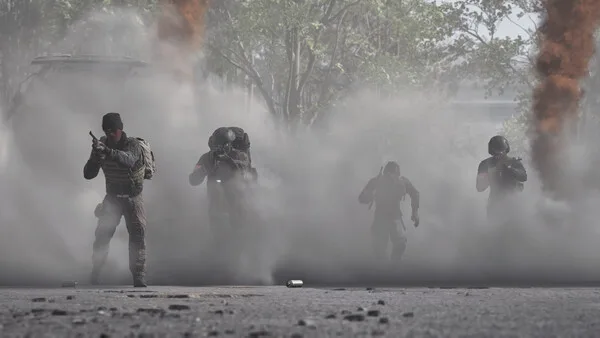 WARDOGS infantry squad moving across the battlefield